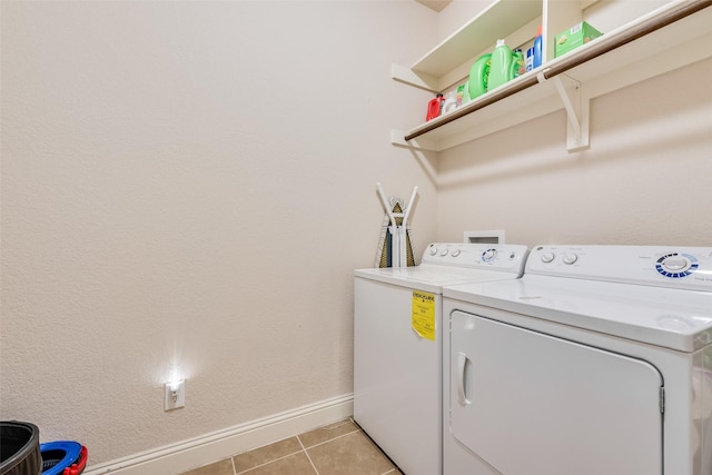 washroom featuring light tile patterned floors and independent washer and dryer