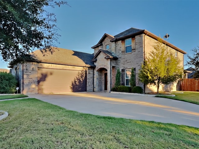 view of front of house with a garage and a front yard