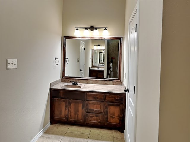 bathroom with vanity and tile patterned floors