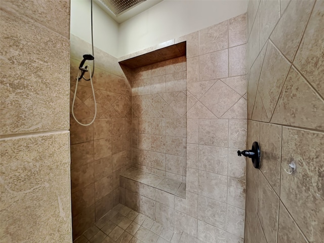 bathroom featuring tiled shower