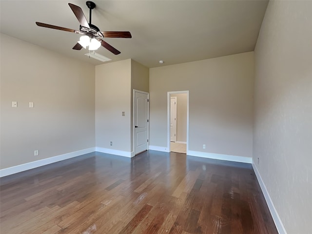 empty room with hardwood / wood-style floors and ceiling fan