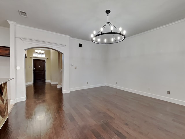 unfurnished dining area with ornamental molding, dark hardwood / wood-style floors, and a chandelier