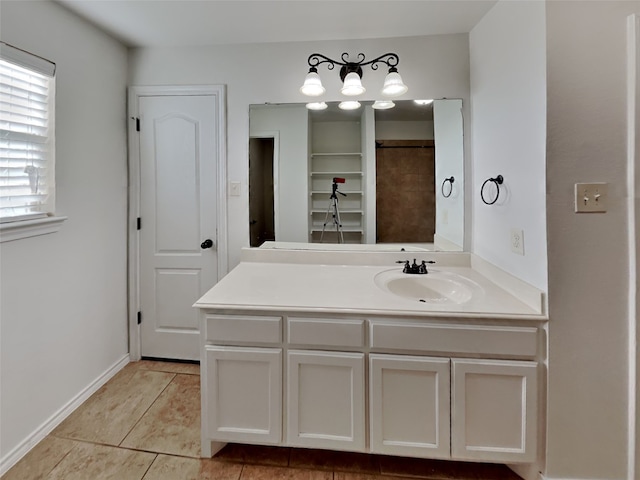 bathroom with tile patterned floors and vanity