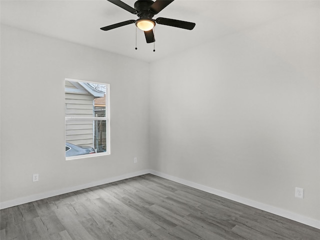 unfurnished room featuring hardwood / wood-style floors and ceiling fan