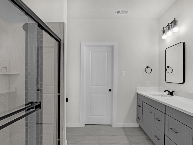 bathroom with vanity and an enclosed shower