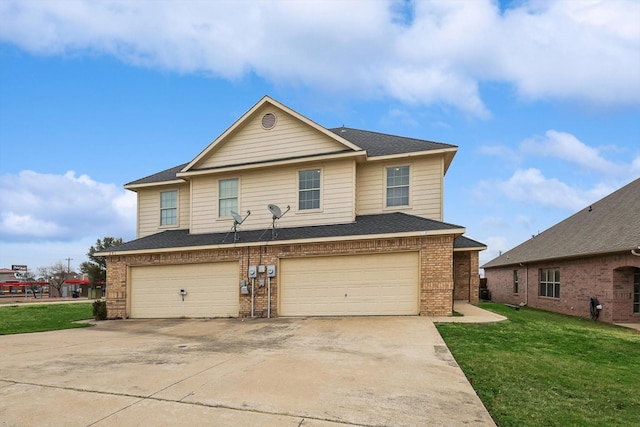 view of property with a garage and a front lawn