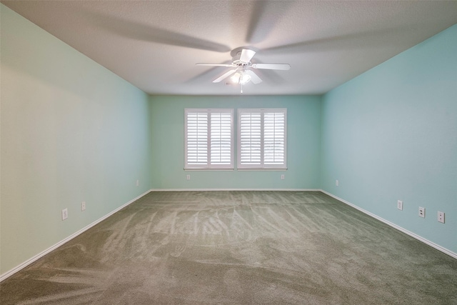 carpeted empty room featuring a textured ceiling and ceiling fan