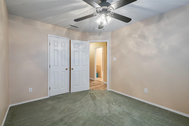 unfurnished bedroom with carpet flooring and ceiling fan