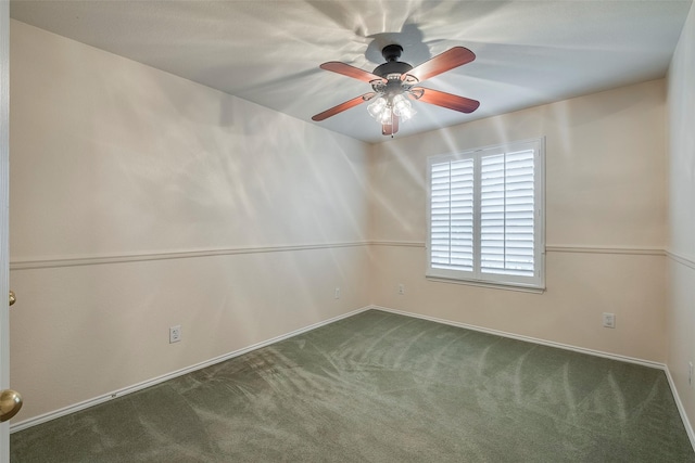 spare room featuring dark carpet