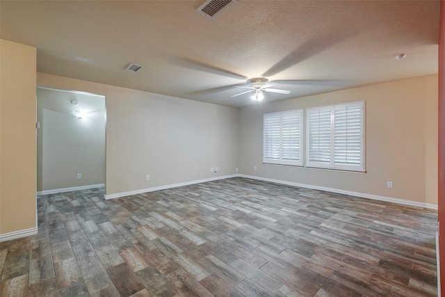 unfurnished room featuring a textured ceiling, wood-type flooring, and ceiling fan