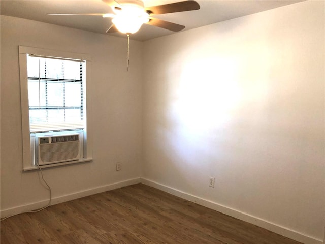 unfurnished room featuring cooling unit, ceiling fan, and dark hardwood / wood-style flooring