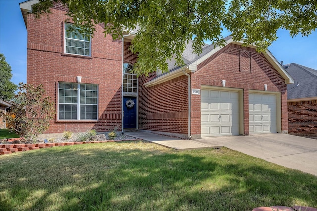 view of front of home with a garage and a front lawn