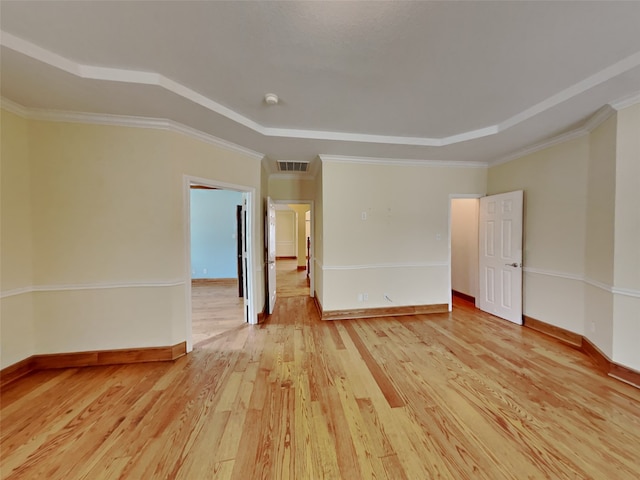 10805 Winged Foot Dr, Rowlett, TX 75089 - empty room with crown molding, light hardwood / wood-style floors, and a tray ceiling