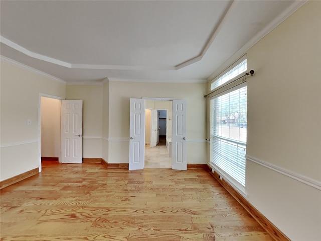 10805 Winged Foot Dr, Rowlett, TX 75089 - empty room with a tray ceiling, light hardwood / wood-style flooring, and ornamental molding