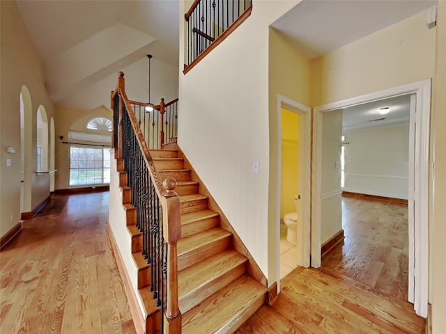 10805 Winged Foot Dr, Rowlett, TX 75089 - stairs featuring hardwood / wood-style flooring and high vaulted ceiling