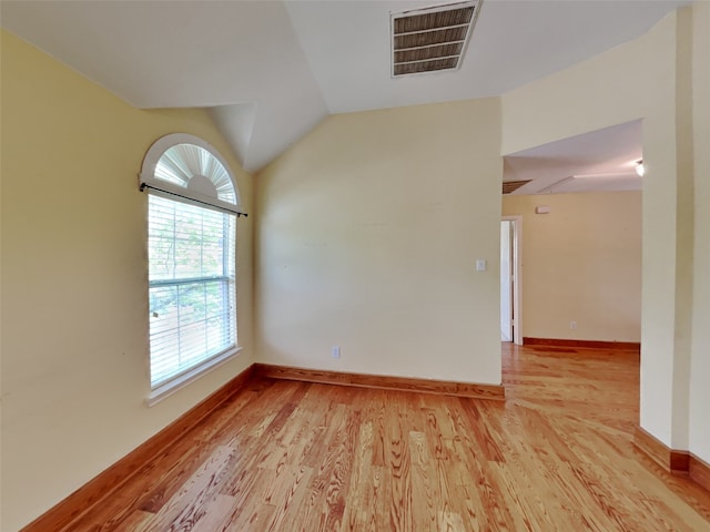 10805 Winged Foot Dr, Rowlett, TX 75089 - spare room with vaulted ceiling and light wood-type flooring