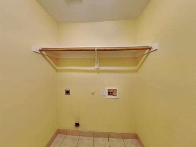 10805 Winged Foot Dr, Rowlett, TX 75089 - laundry room featuring hookup for a washing machine, gas dryer hookup, electric dryer hookup, and tile patterned floors