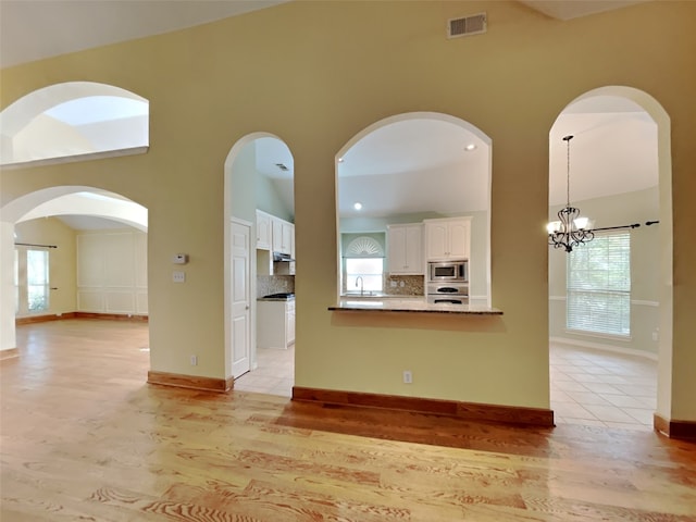 10805 Winged Foot Dr, Rowlett, TX 75089 - interior space with appliances with stainless steel finishes, sink, a wealth of natural light, and white cabinets
