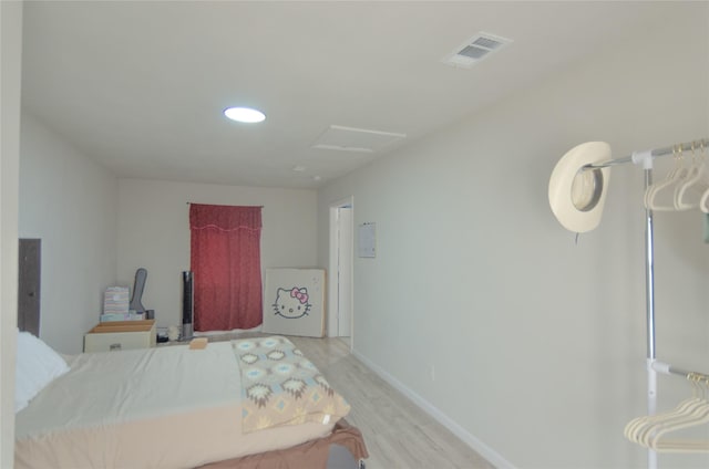 bedroom with light hardwood / wood-style floors