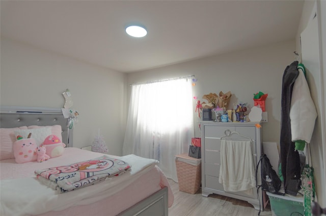 bedroom with light wood-type flooring