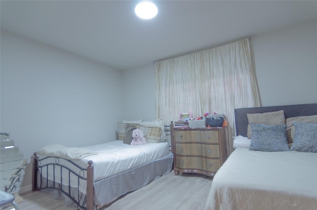 bedroom with light wood-type flooring