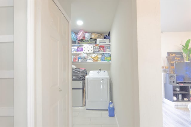 washroom featuring washer and clothes dryer