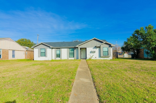 ranch-style home with a front lawn