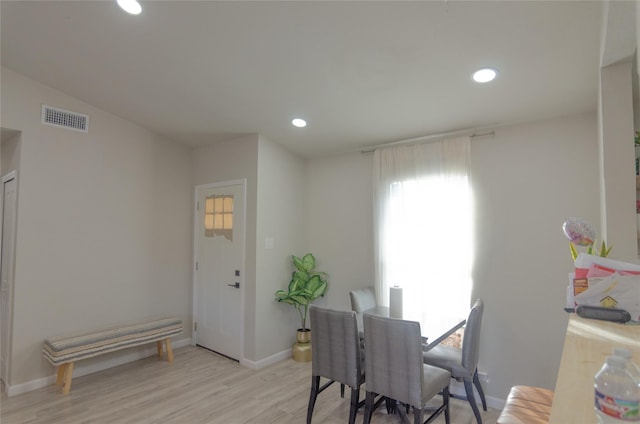 dining space with light hardwood / wood-style floors