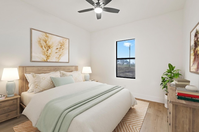 bedroom featuring ceiling fan and light wood-type flooring