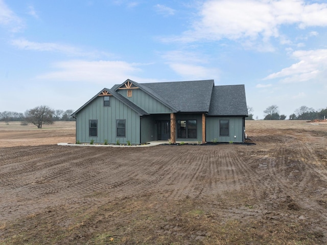 view of front facade featuring a rural view