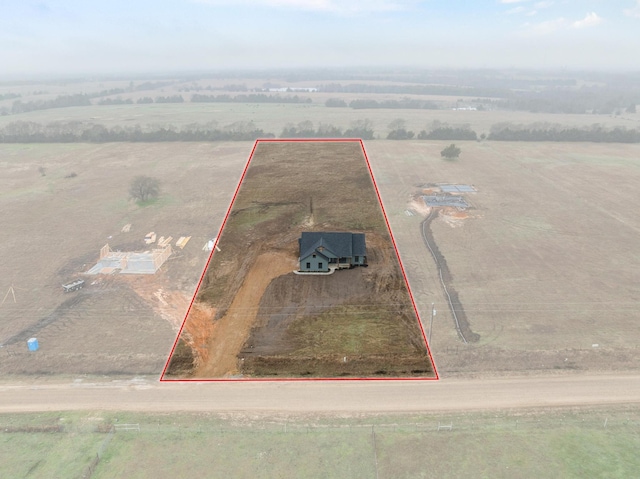 birds eye view of property featuring a rural view