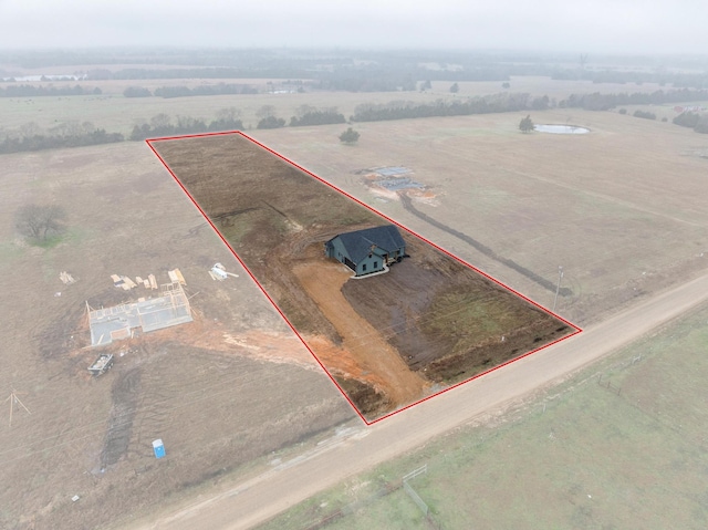 birds eye view of property featuring a rural view