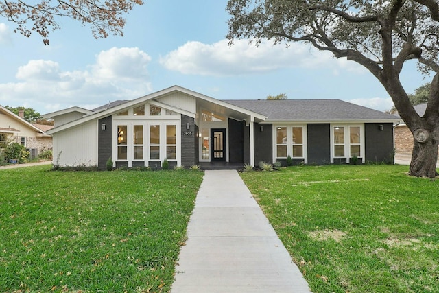 ranch-style house with a front lawn