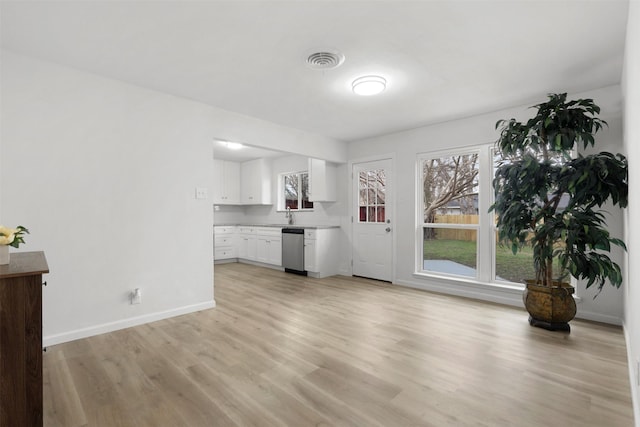 unfurnished living room featuring light wood-type flooring