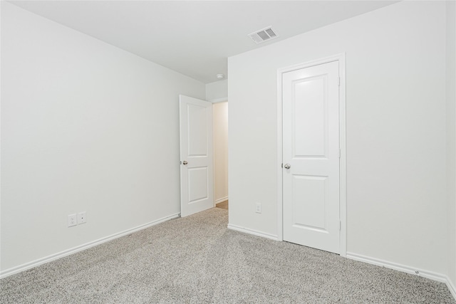 unfurnished bedroom featuring light colored carpet