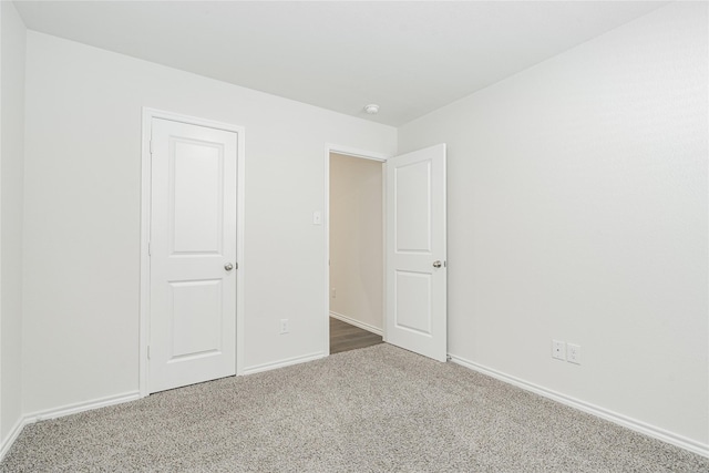 unfurnished bedroom with carpet flooring