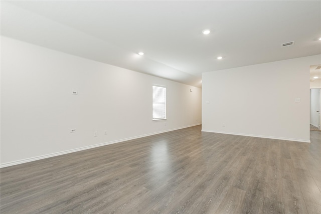 unfurnished room with hardwood / wood-style flooring