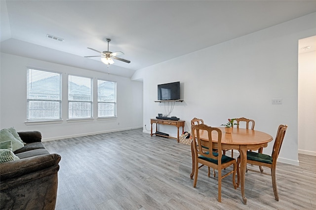 dining area featuring lofted ceiling, light hardwood / wood-style flooring, and ceiling fan