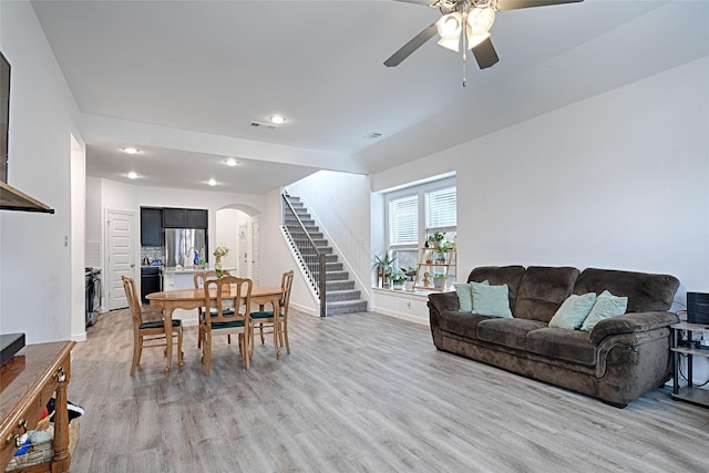 dining area featuring ceiling fan and light hardwood / wood-style flooring