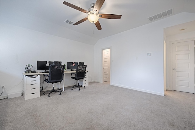 office area featuring ceiling fan, vaulted ceiling, and light carpet