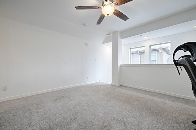 carpeted empty room with ceiling fan