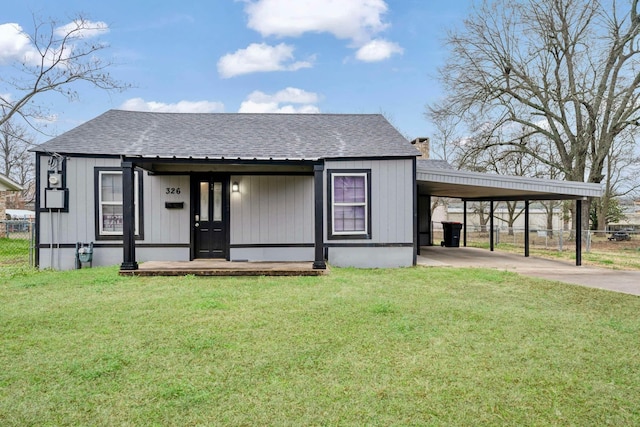 view of front of house with a carport, a porch, and a front lawn