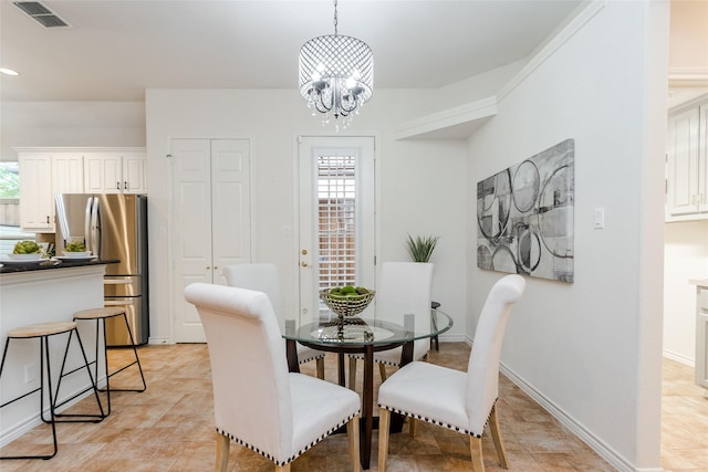 dining space featuring visible vents, baseboards, and an inviting chandelier