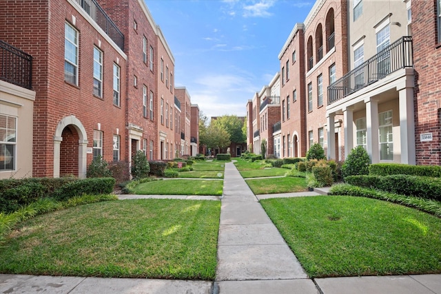 view of home's community with a lawn