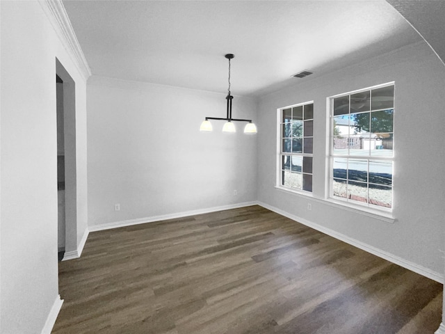 unfurnished dining area with crown molding and dark hardwood / wood-style floors