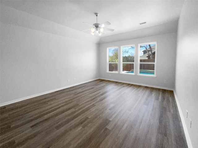 unfurnished room featuring ceiling fan and dark hardwood / wood-style floors