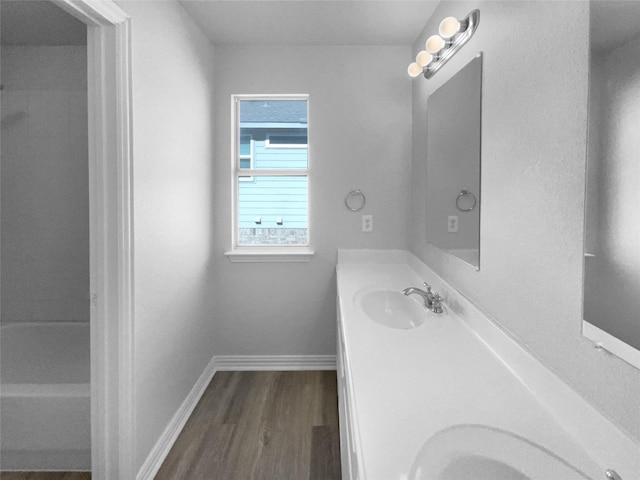 bathroom featuring vanity and hardwood / wood-style floors