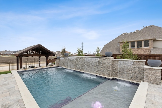 view of pool with a patio area, a fenced backyard, a fenced in pool, and a gazebo