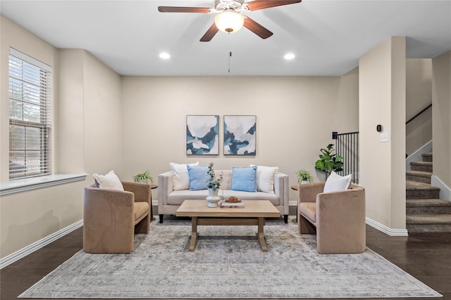 living room featuring hardwood / wood-style flooring and ceiling fan