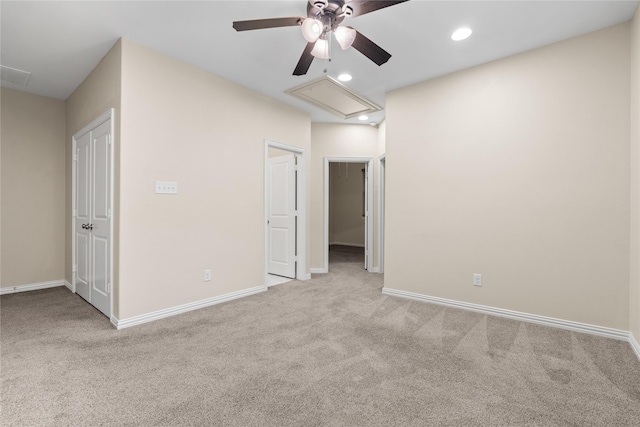 unfurnished bedroom with light carpet and ceiling fan